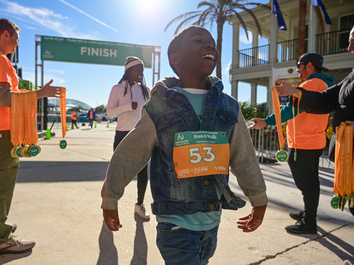 boy crossing finish line.png