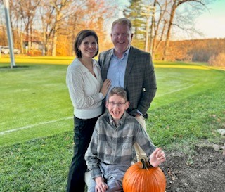 Landon with mom and dad.jpg